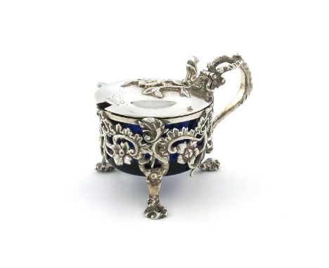 A William IV silver mustard pot, by Paul Storr, London 1832, circular form, pierced and chased with foliate and scroll decora