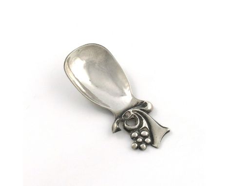 By R. E. Stone, a modern silver caddy spoon, Edinburgh 1973, oblong spot-hammered bowl, the terminal with berry and scroll de