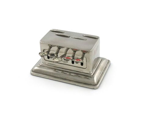 A chrome-plated bridge marker, marked Rowenta D.R.P., rectangular form, with four press-down leavers with pop up the playing 