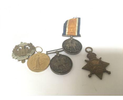 Three First World War medals awarded to Pte J Hood 14210 Essex R with a cap badge and one other I world war medal awarded to 