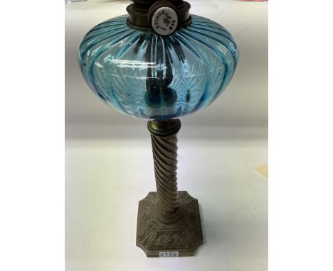 A Victorian brass twist column Oil lamp with blue glass reservoir. 50cm