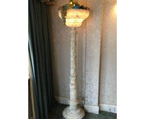 A large carved Marble early 20thC lamp with a collection of model fruit. 185cm.
