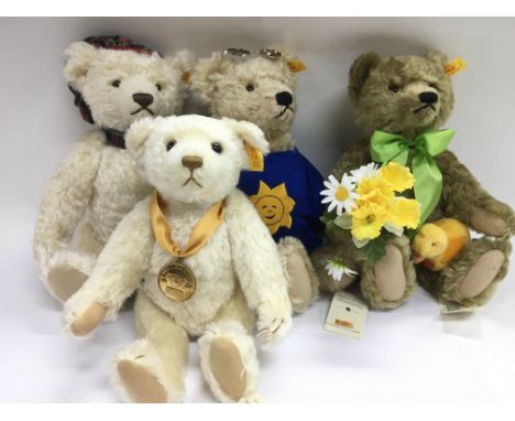 Four modern Steiff bears.