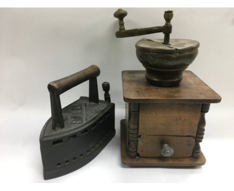 A vintage coffee grinder and a cast iron flat iron (2).