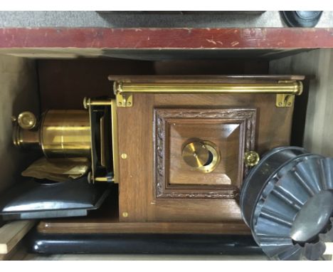 A magic lantern with slides two boxes of various slides .