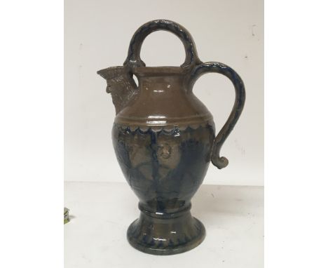 A Victorian Castle Hedingham pottery jug the spout with a bearded figure. With blue decoration Hight 28cm no obvious damage.