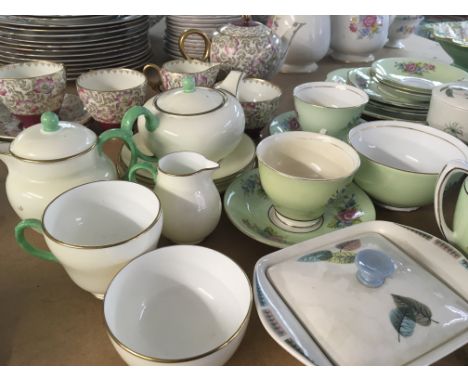 A collection of decorative English porcelain tea cups Royal Stafford Wedgwood two Grays pottery storage jars (a lot) NO RESER