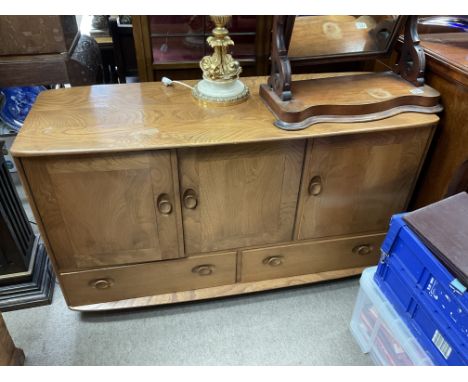 A blonde Ercol sideboard. 130 x 48 x 76cm