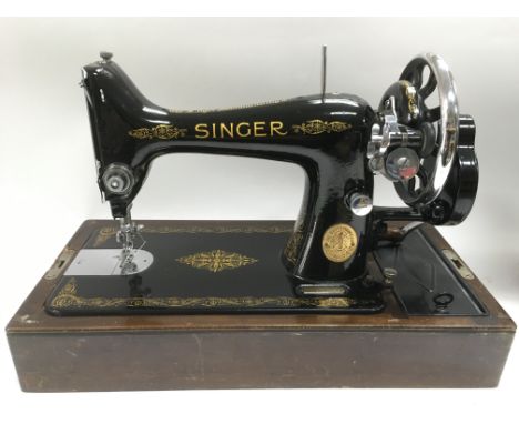 A vintage cased Singer sewing machine.
