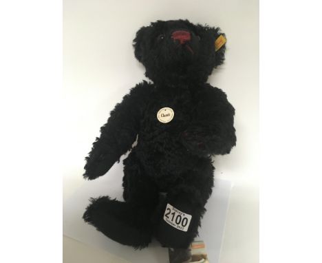 A Steiff Classic Black bear with attached tag and label.