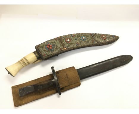 A British bayonet and leather scabbard together with a bone handled Jambiya (2). NO RESERVE