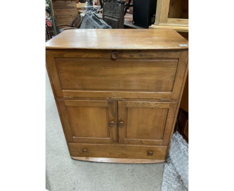 A Blonde Ercol Windsor serving cabinet. 97 x 82 x 50cm