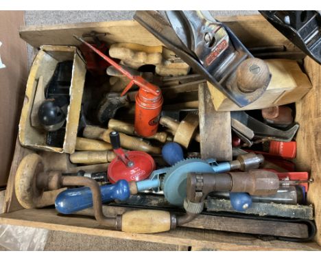A box of mixed woodworking tools.