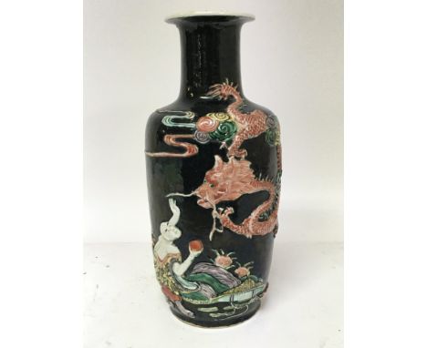 A Chinese export Republic period vase decorated with raised dragons and figures on a Noir ground lamp conversion. Marks to th