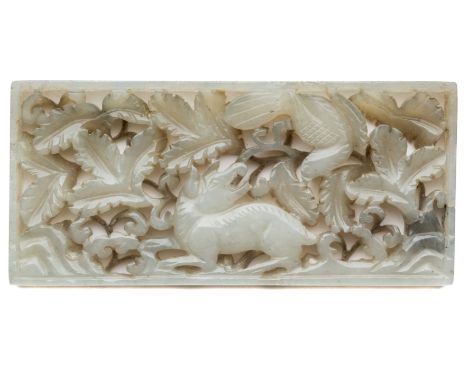 A CHINESE JADE PLAQUE, 18TH CENTURY the rectangular plaque carved and pierced with a mythical beast with bird in flight over 