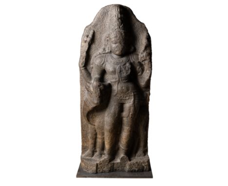 A CHOLA GRANITE FIGURE OF ARDHANISVARA, TAMIL NADU, SOUTH INDIA, 11TH / 12TH CENTURY the four-armed composite deity standing 