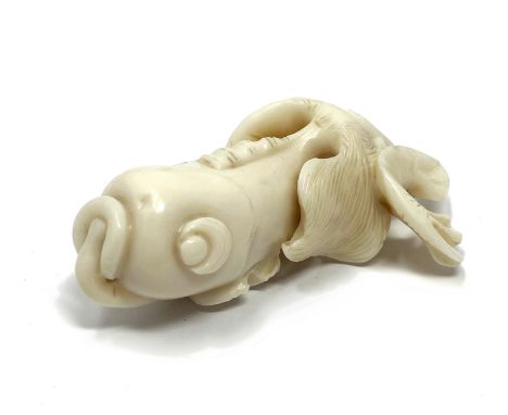 A WHITE CORAL FIGURE OF A GOLDFISH, PROBABLY CHINESE 19TH CENTURY the fantail fish carved with a branch of seaweed in its mou