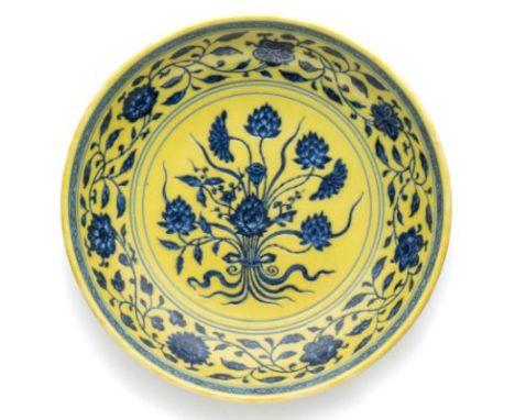 A CHINESE IMPERIAL YELLOW-GROUND BLUE AND WHITE 'LOTUS BOUQUET' DISH, YONGZHENG MARK AND PERIOD (1723-35) the rounded sides r