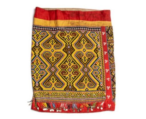 * A BEADED SKIRT, KALIMANTAN, BORNEO, FIRST HALF 20TH CENTURY formed from a rectangular panel stitched into a cylinder with c