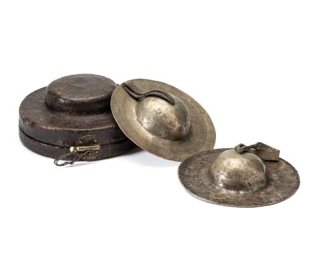 *A PAIR OF RITUAL CYMBALS (ROLMO), TIBET, 19TH CENTURY alloy, the interior of the domes with red and gold svastika design, ea