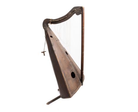 *A FOLK HARP, MEXICO, 19TH/EARLY 20TH CENTURY wood, with steel strings and iron pegs, the tapered faceted sound box with thre