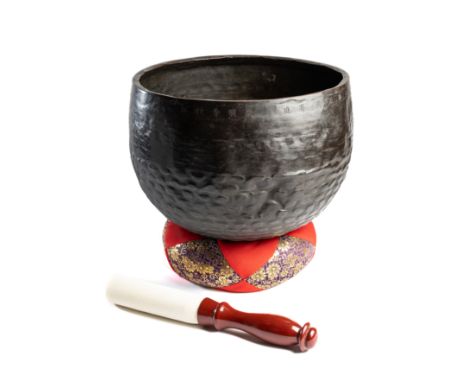 *A CUP GONG (DOBACHI), JAPAN, CIRCA 18TH CENTURY beaten copper alloy, of bowl shaped form, the lower sides with scale motifs 