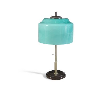 A 1960s brass table lamp, with a green glass shade, by Vistosi, Italy. 50cm high.