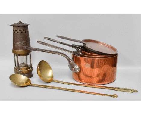 Four Assorted 19th Century Copper Saucepans, with iron handles and two lids, largest stamped Benham, London, together with a 