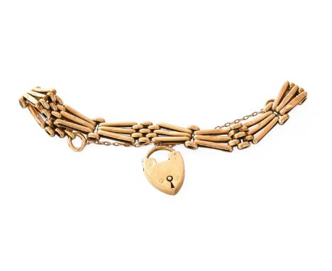 An Gate Link Bracelet, stamped '18CT', with an 18 carat gold heart-shaped padlock clasp, length 19cmGross weight- 20.9 grams