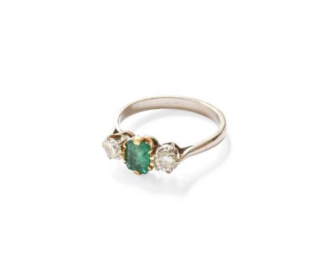 An Emerald and Diamond Three Stone Ring, the rectangular step-cut emerald in a yellow claw setting, flanked by round brillian