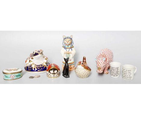 Three Royal Crown Derby Imari Paperweights; together with a porcelain candle snuffer formed as an Egyptian cat, a Herend mode