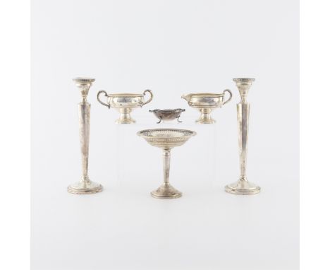 Group of six sterling pieces including one pair of weighted tall candlestick holders, marked Sterling MFH weighted.One pierce