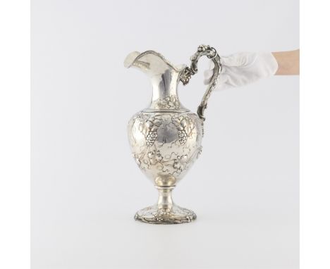 Harris &amp; Schaffer Co., United States. Sterling silver ewer with repousse grape vine details throughout the base, body and