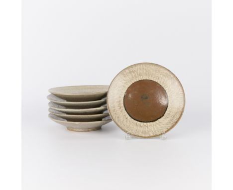 Tatsuzo Shimaoka (Japanese, 1919-2007). Group of six studio ceramic large dinner plates, 20th century. Stoneware of an iron-s
