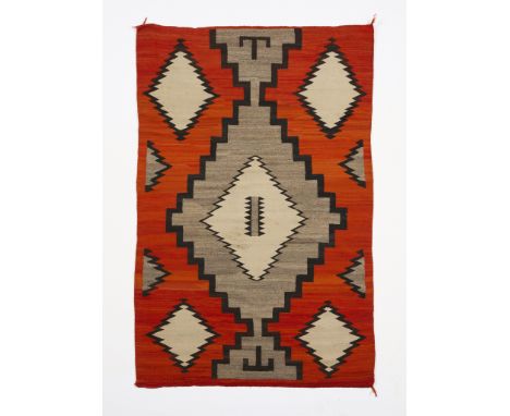 Early 20th century Dine or Navajo wool revival weaving or rug textile featuring a Ganado pattern and color palette, ca. 1920.