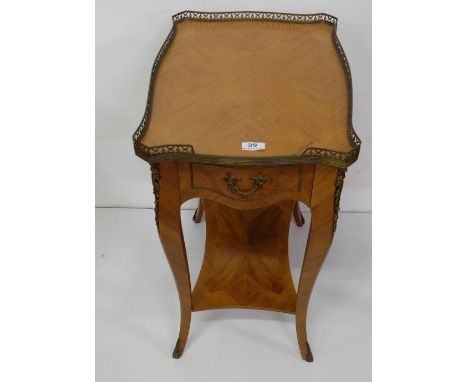 Kingwood Lamp Table with raised brass gallery, an apron drawer and stretcher shelve, sabre legs, brass toes, 19.5”w x 14”d