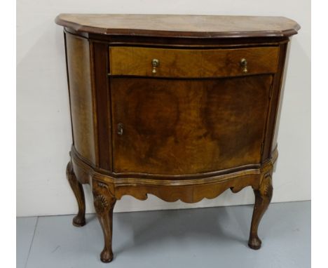 Walnut Side Cabinet, with a serpentine front, apron drawer and single door, on Queen Ann legs, 33”h x 33”