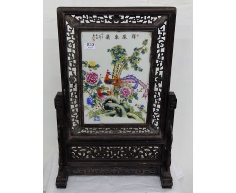 Chinese Fire Screen with porcelain insert, decorated with a peacock in a natural setting, fretwork borders, 26”h