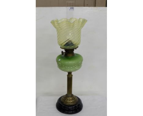 Victorian Oil Lamp, a green tulip shaped shade over a green bowl and brass base