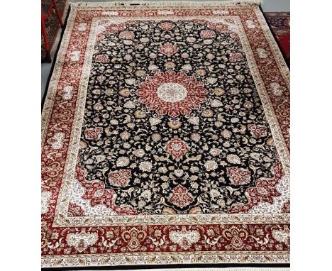 Black ground woven silk carpet with a medallion design and red border 2.9m x 2m
