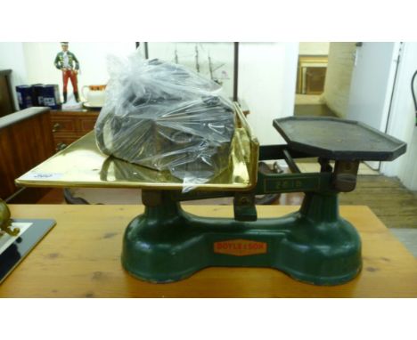 A pair of mid 20thC Doyle & Son green painted iron grocer's scales with attendant weights       CA