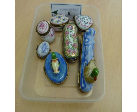 Seven various modern painted porcelain and lacquered brass mounted trinket boxes: to include one fashioned as a duck on water