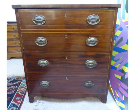 An early 19thC satinwood, string inlaid mahogany night commode, fashioned as a small dressing chest with a four facsimile dra