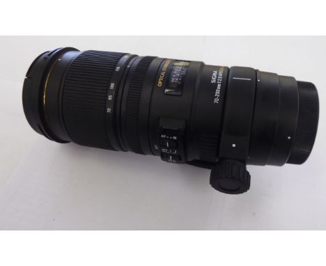 A Sigma 70-200mm, 1:2.8 APO, DG, HSM camera lens with an optical stabilizer feature       CS