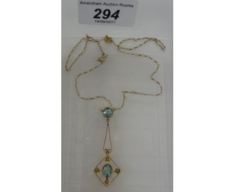 A 9ct gold framed gemstone and seed pearl set pendant, on a fine neckchain         11