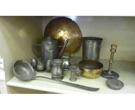 Miscellaneous 19thC and later pewter and other metalware: to include a quart size beaker measure; a soup ladle; and a three p