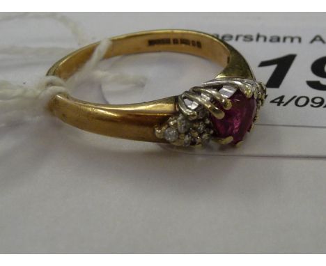 A 9ct gold claw set ruby and diamond ring         11    