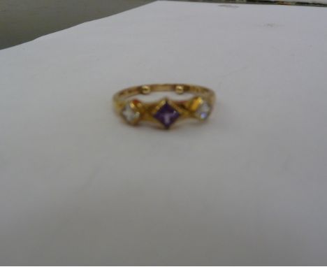 A 9ct gold ring, set with white and coloured stones       11