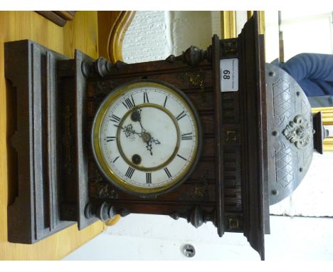 An early Continental 20thC oak and gilt metal mounted mantel clock with a domed top, on a bracket plinth; the Jonghans gong s