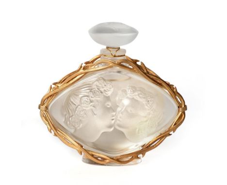 Le Baiser by Lalique Advertising Display Dummy Factice, the frosted elliptical scent bottle moulded with the faces of a coupl